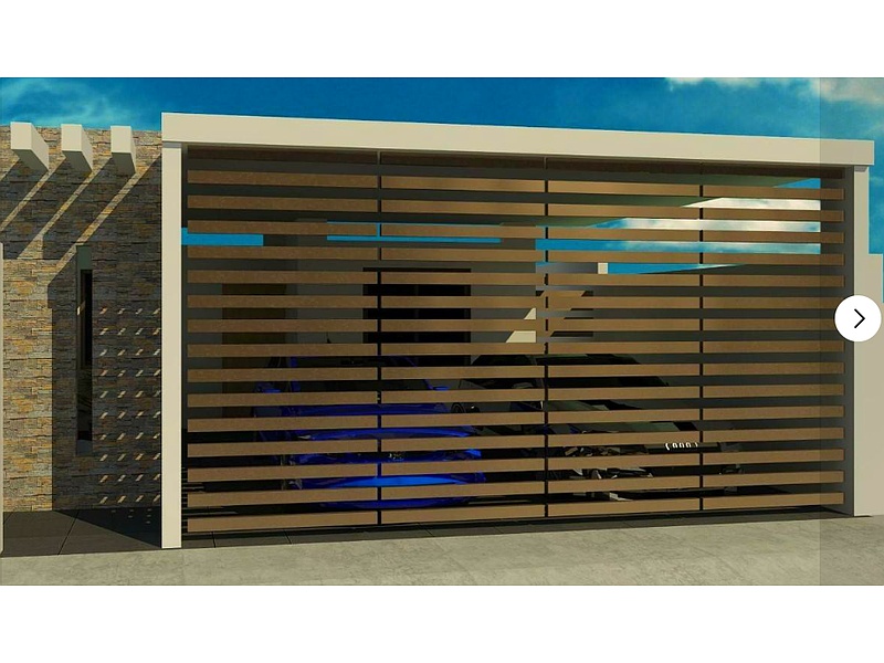 puerta tipo reja de garaje color dorado Mérida Construcción y Mantenimiento Casares